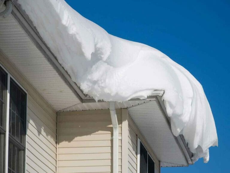 how snow and ice impact your roof