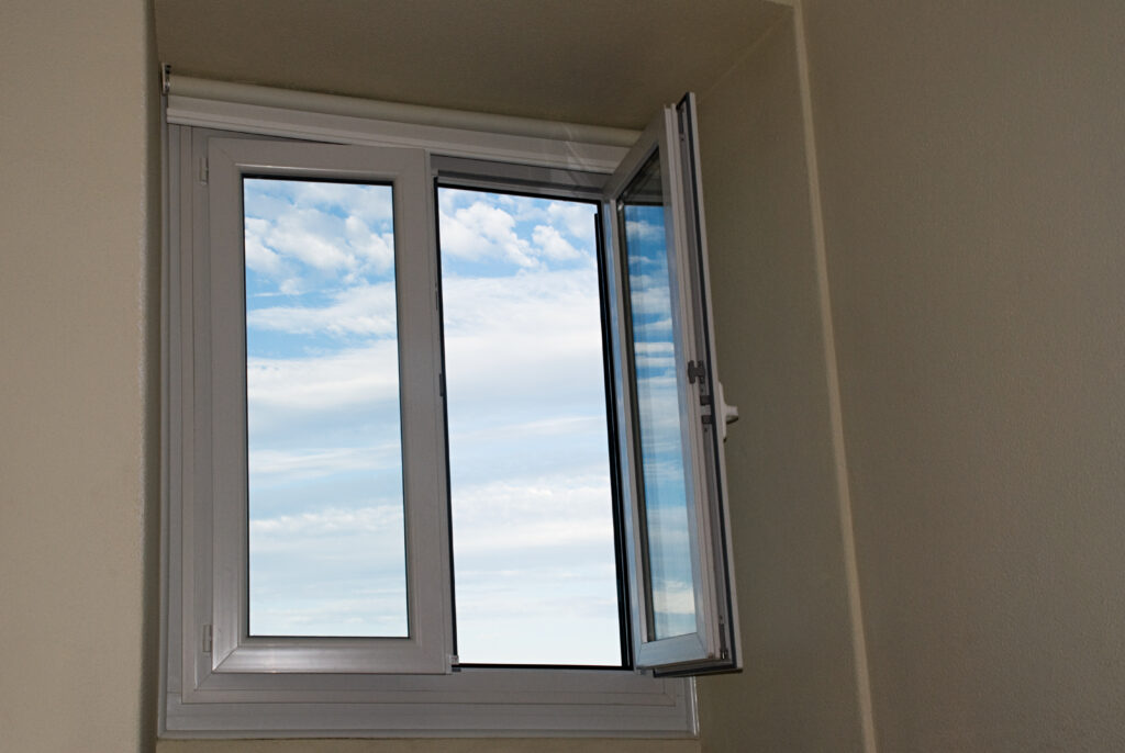 a photo of casement window to answer the question "What is a casement window?"
