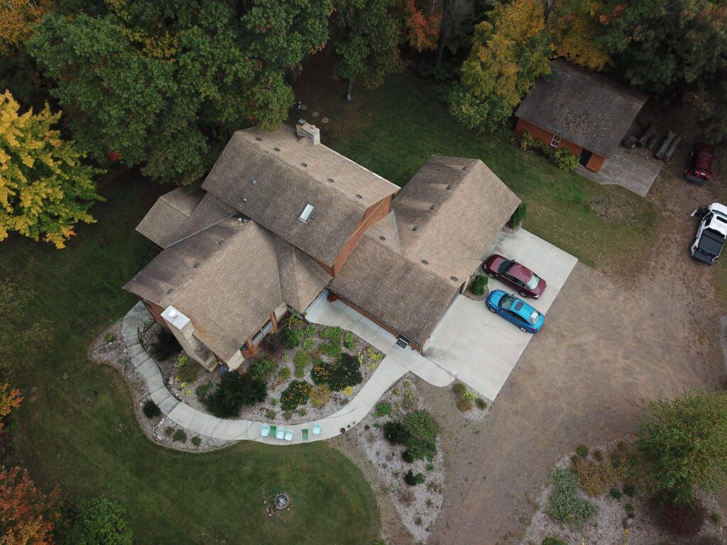 Metal roofing Cambridge MN - before photo, aerial view of old asphalt shingle roof