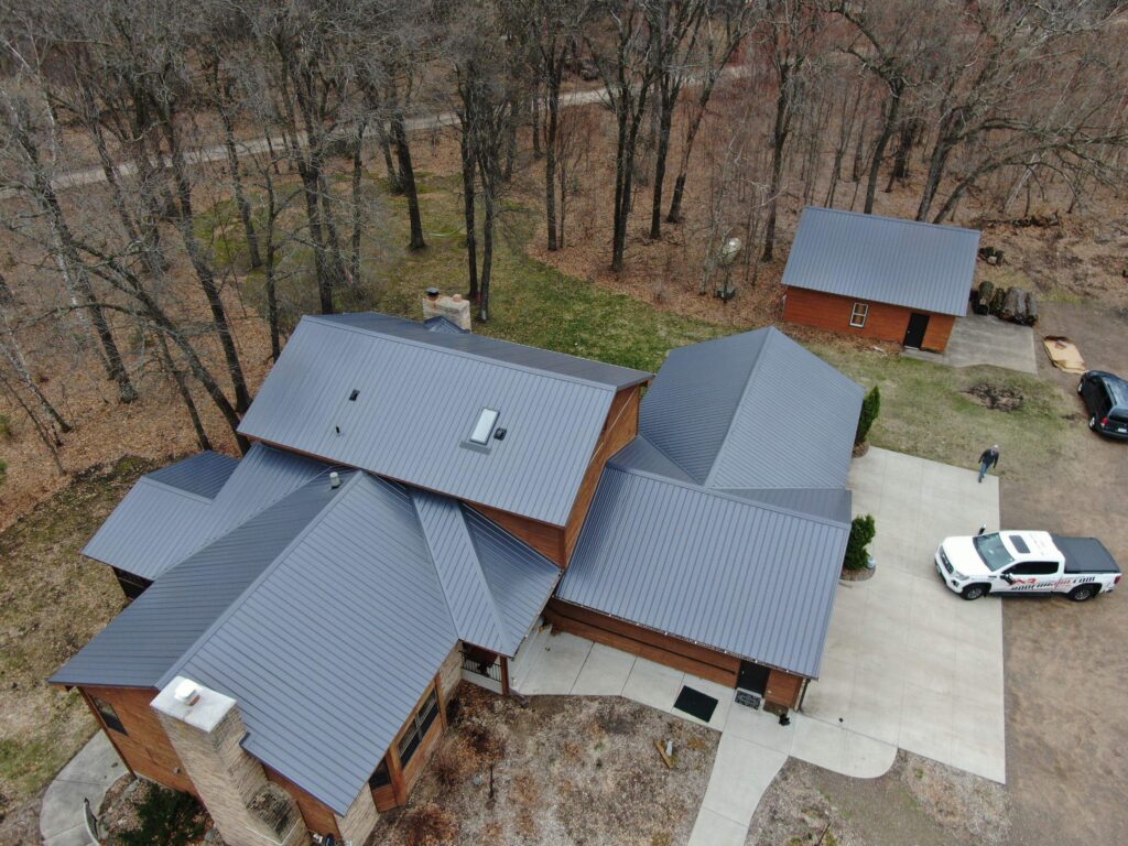 Metal roofing Cambridge MN - after photo, aerial view of new gray standing seam metal roof